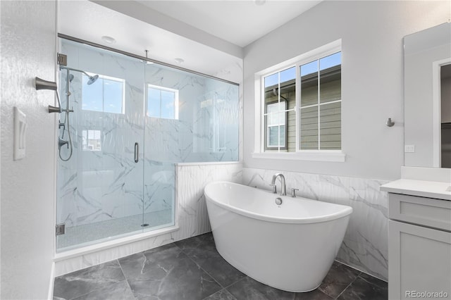 6683 Bridle Creek Pt, Castle Pines, CO 80108 - bathroom featuring marble finish floors, healthy amount of natural light, a marble finish shower, tile walls, and a wainscoted wall