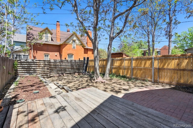 1529 E 22nd Ave, Denver, CO 80205 - wooden deck with a fenced backyard and a patio area