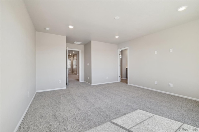 unfurnished room featuring light colored carpet