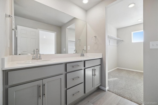 bathroom with vanity and hardwood / wood-style floors