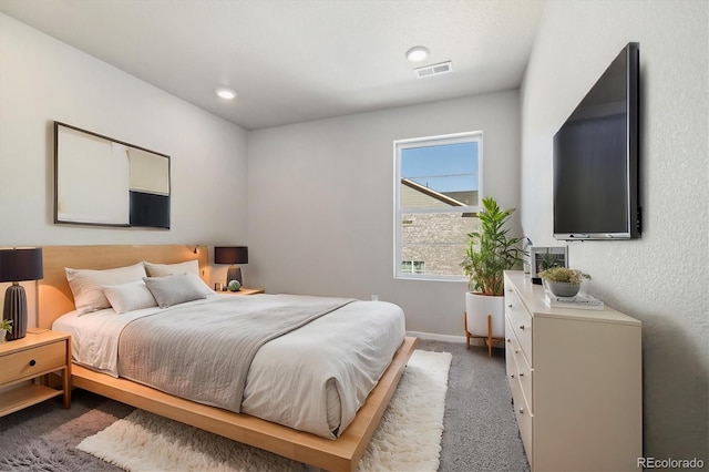 bedroom with dark carpet