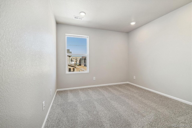 spare room with carpet flooring