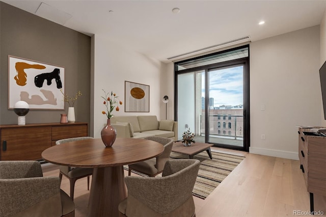 1901 Wazee St Unit 707, Denver, CO 80202 - dining space featuring light wood-style flooring, floor to ceiling windows, and recessed lighting