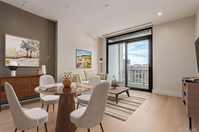 1901 Wazee St Unit 707, Denver, CO 80202 - dining room featuring light wood-style floors, expansive windows, and recessed lighting