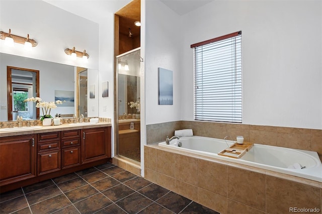 bathroom with vanity, independent shower and bath, and tile patterned floors