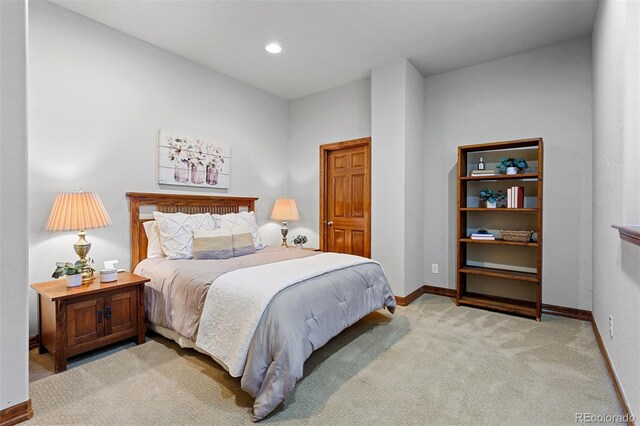 bedroom featuring light colored carpet