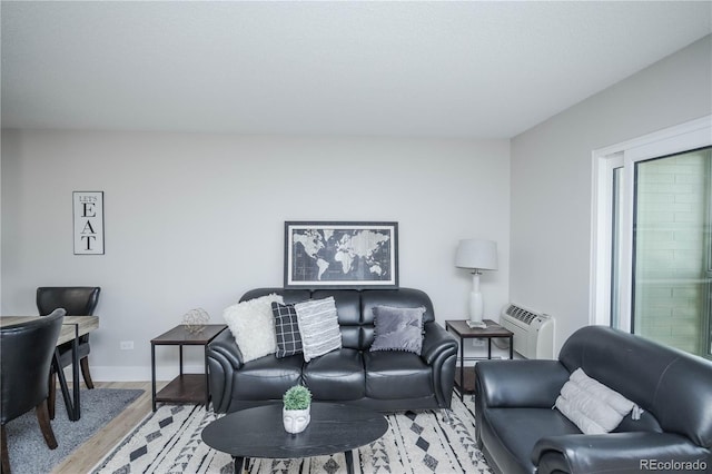 9155 E Center Ave Unit 4B, Denver, CO 80247 - living room featuring wood finished floors and an AC wall unit