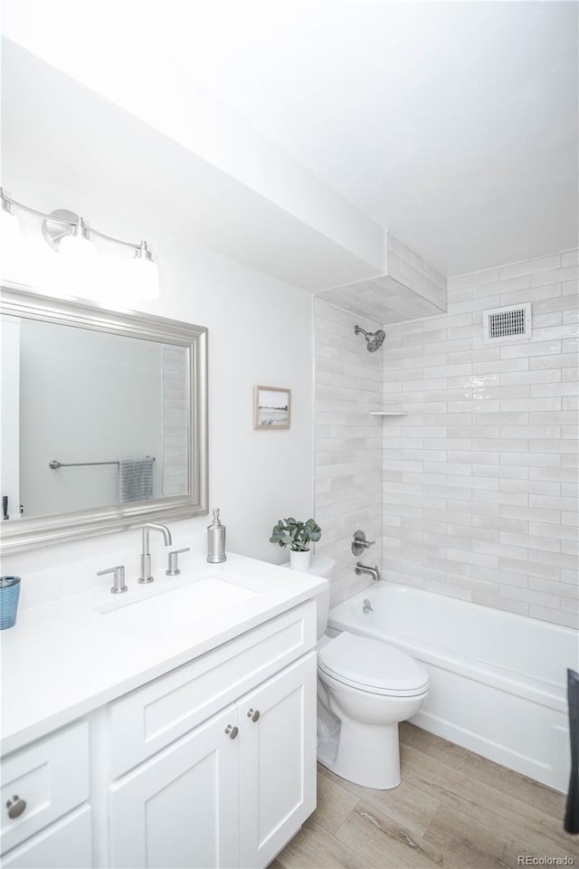 9155 E Center Ave Unit 4B, Denver, CO 80247 - full bath featuring vanity, shower / washtub combination, and wood finished floors