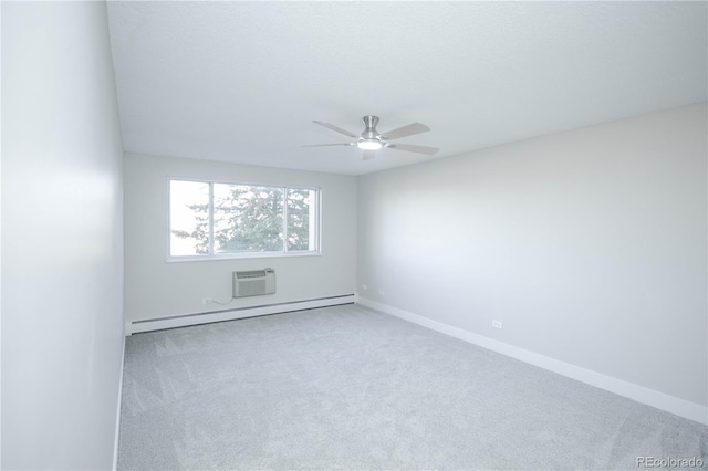 9155 E Center Ave Unit 4B, Denver, CO 80247 - unfurnished room with a baseboard radiator, a ceiling fan, carpet flooring, and a wall mounted AC