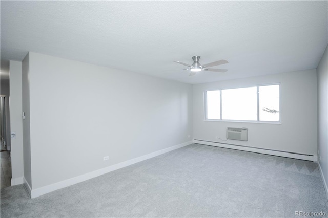 9155 E Center Ave Unit 4B, Denver, CO 80247 - unfurnished room featuring a baseboard heating unit, carpet, ceiling fan, a wall unit AC, and a textured ceiling
