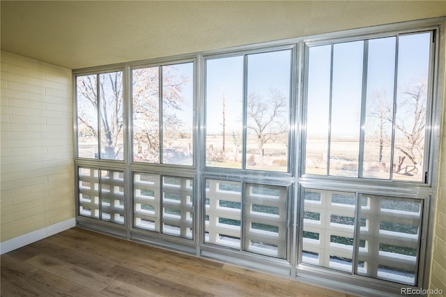 9155 E Center Ave Unit 4B, Denver, CO 80247 - detailed view of wood finished floors and baseboards