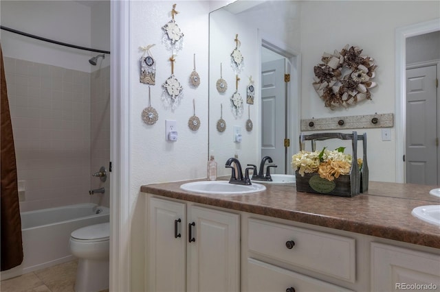 full bathroom with shower / bathtub combination with curtain, vanity, and toilet