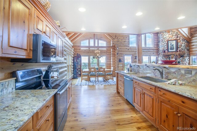 514 Little Baldy Cir, Fairplay, CO 80440 - kitchen with rustic walls, stainless steel appliances, a sink, light wood finished floors, and recessed lighting