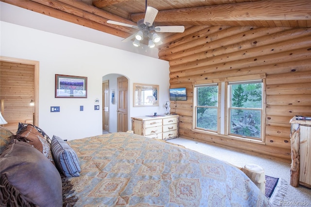 514 Little Baldy Cir, Fairplay, CO 80440 - bedroom with arched walkways, log walls, carpet, wood ceiling with exposed beams, and ceiling fan