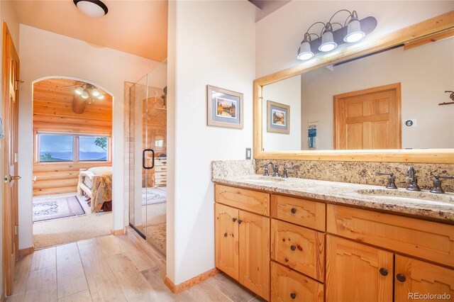 514 Little Baldy Cir, Fairplay, CO 80440 - ensuite bathroom with wood finished floors, a shower stall, and double vanity