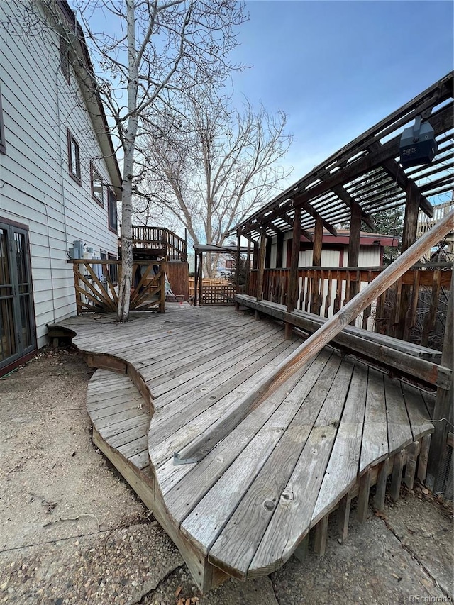 wooden deck featuring a pergola