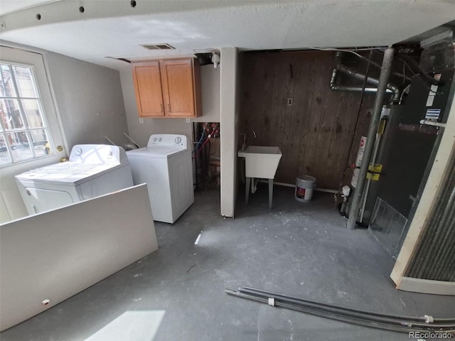 2758 S Salida St, Aurora, CO 80013 - laundry room featuring cabinet space, washer and dryer, and wood walls