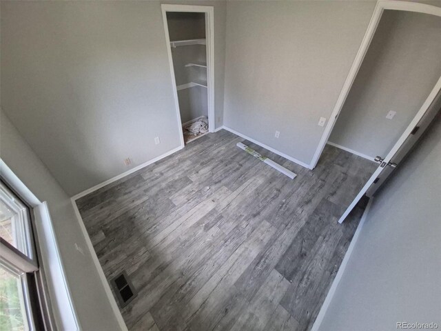 2758 S Salida St, Aurora, CO 80013 - unfurnished bedroom featuring wood finished floors and baseboards