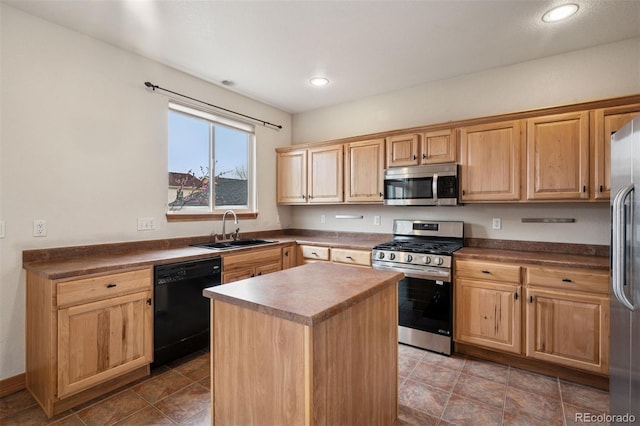kitchen featuring stainless steel appliances, a sink, and light brown cabinetry