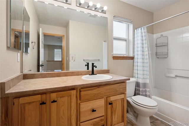 full bath with toilet, visible vents, vanity, and shower / tub combo with curtain