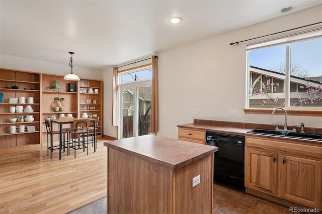 kitchen with open shelves, a kitchen island, black dishwasher, a sink, and hanging light fixtures