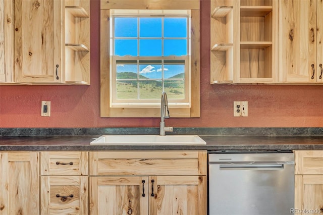 kitchen featuring sink, light brown cabinets, and stainless steel dishwasher