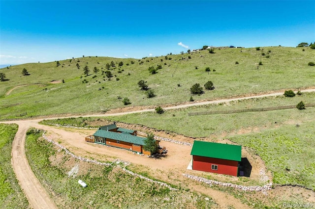 birds eye view of property with a rural view