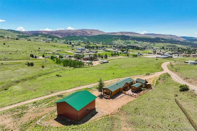 drone / aerial view featuring a rural view and a mountain view