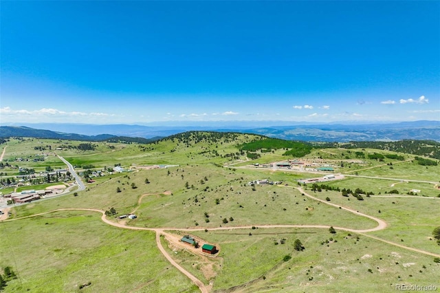 drone / aerial view featuring a rural view and a mountain view