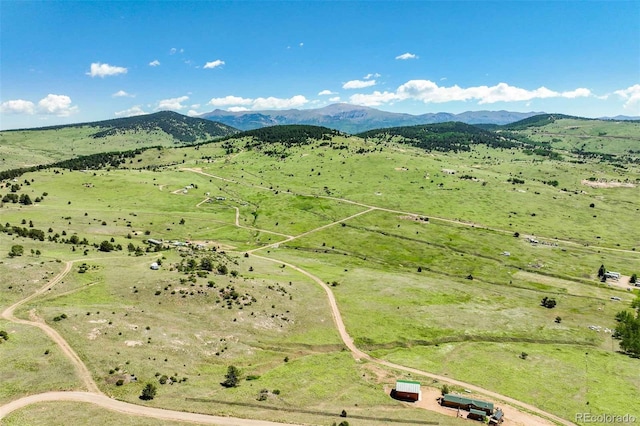 bird's eye view featuring a rural view and a mountain view