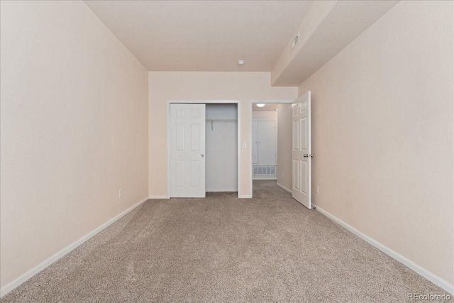 16848 E Gunnison Dr Unit 9E, Aurora, CO 80017 - unfurnished bedroom with carpet floors, baseboards, and a closet