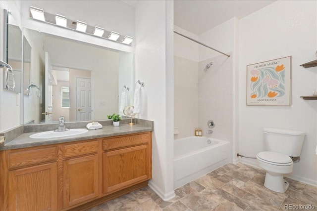 16848 E Gunnison Dr Unit 9E, Aurora, CO 80017 - full bathroom featuring toilet, vanity, shower / bathtub combination, baseboards, and stone finish flooring