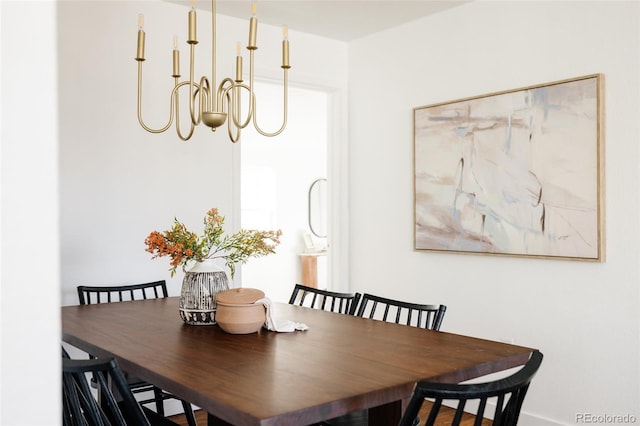 dining space featuring an inviting chandelier