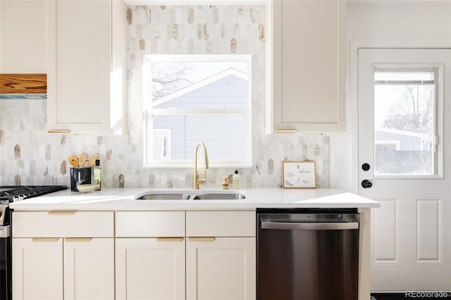 kitchen featuring sink, appliances with stainless steel finishes, backsplash, extractor fan, and white cabinets