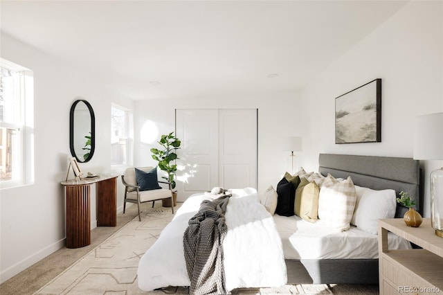 carpeted bedroom with a closet