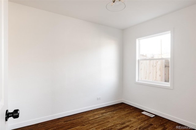 unfurnished room featuring dark hardwood / wood-style floors