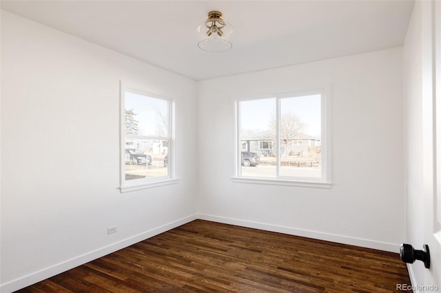 empty room featuring dark hardwood / wood-style flooring