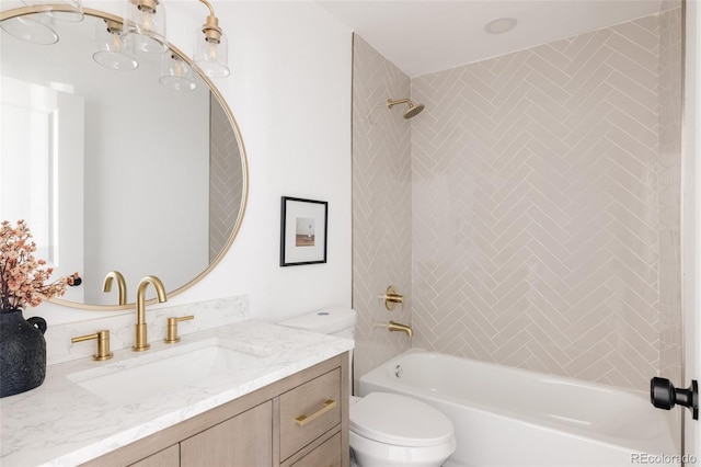 full bathroom with vanity, tiled shower / bath combo, and toilet