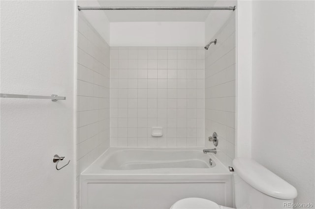 full bathroom featuring toilet and  shower combination