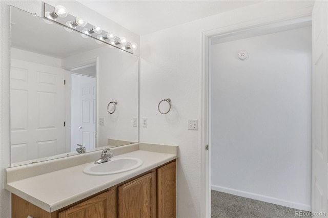 bathroom with vanity and baseboards