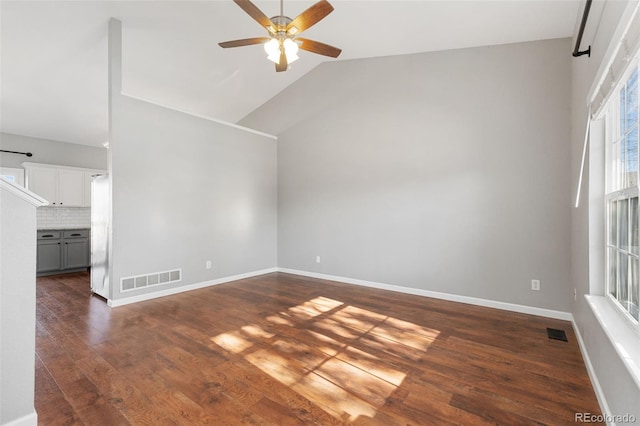 additional living space featuring high vaulted ceiling, ceiling fan, and dark wood-type flooring