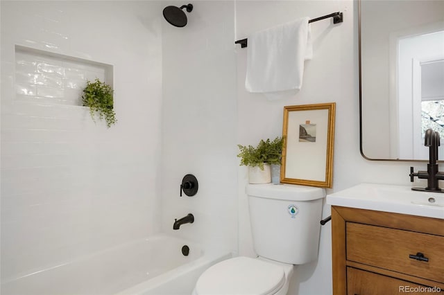 bathroom with toilet, shower / bathtub combination, and vanity