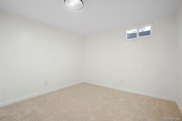 carpeted spare room with baseboards