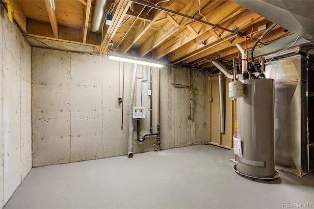 unfinished basement featuring water heater