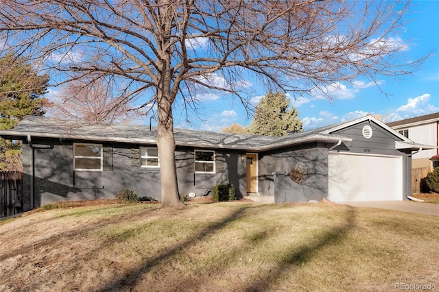 single story home with driveway, a front lawn, and an attached garage