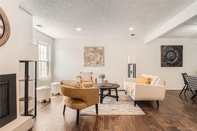 13020 E Linvale Pl, Aurora, CO 80014 - living area with a textured ceiling, visible vents, dark wood-type flooring, and recessed lighting