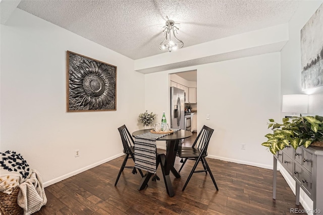 13020 E Linvale Pl, Aurora, CO 80014 - dining area with baseboards, dark wood-style flooring, and a textured ceiling