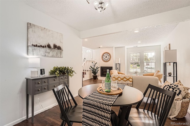 13020 E Linvale Pl, Aurora, CO 80014 - dining area with a textured ceiling, baseboards, and dark wood-style floors