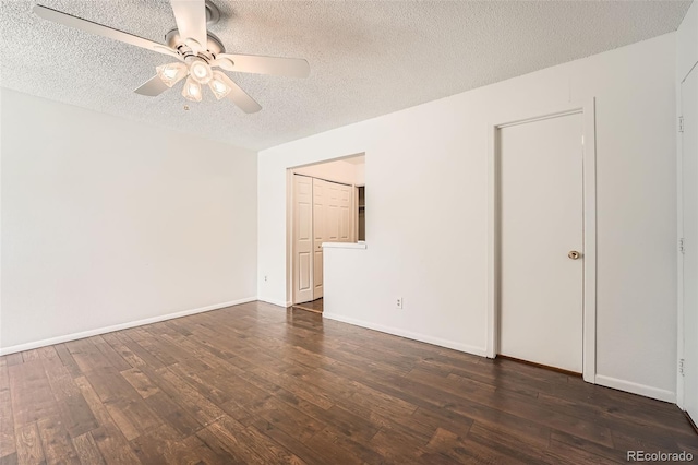 13020 E Linvale Pl, Aurora, CO 80014 - empty room with a textured ceiling, dark wood-style flooring, and a ceiling fan