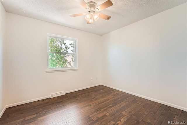 13020 E Linvale Pl, Aurora, CO 80014 - spare room with dark wood finished floors, visible vents, baseboards, and ceiling fan